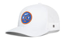White Haka Hat New York Hockey Trucker Hat featuring a round blue patch with an orange border, an illustration of two crossed hockey sticks, a puck, and the letters N and Y.