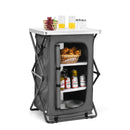 The DirectDeals Folding Camping Storage Cabinet with 3 Shelves and Carry Bag features a white top holding drinks, croissants, and fruit; inside, shelves organize cans, bottles, and a basket of croissants.
