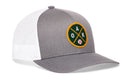 The Haka Hat Oakland Baseball Trucker Hat | OAK X Snapback is a gray and white mesh snapback featuring a round front patch with green, yellow, and black accents, the letters OAK, and a small baseball icon—perfect for any Oakland baseball hat collection.