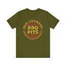 Unisex BBQ t-shirt worn by man and woman grilling together – premium fit, available at DDR BBQ Supply