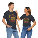 Unisex BBQ t-shirt worn by man and woman grilling together – premium fit, available at DDR BBQ Supply