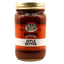 An 18 oz glass jar of Old School Brand Apple Butter with a gold lid and a red and white label featuring “Apple Butter,” “All Natural,” and “Non-GMO.”.
