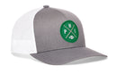 The Haka Hat Philadelphia Football Trucker Hat, also known as the Kelly Green PHI X Snapback by Haka Hat, features a gray and white design with a green circular patch on the front showcasing crossed lines, the letters “P” and “H,” and a small football icon—honoring classic Philadelphia Football style in a timeless snapback silhouette.