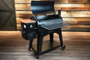 Black Pit Boss Austin XL pellet grill featuring the Pimp My Grill® Gen2 Slide-Out Rack System with two extended metal racks, a copper-colored hopper lid, and a matching chimney cap.