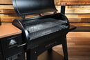 Black Pit Boss Austin XL pellet grill featuring the Pimp My Grill® Gen2 Slide-Out Rack System with two stacked metal racks, shown with the lid open.