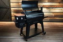 Black Pit Boss Austin XL pellet grill with the lid open, showcasing a Pimp My Grill® Gen2 Slide-Out Rack System with two internal metal racks.