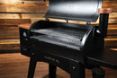 A black Pit Boss Austin XL pellet grill with the lid open, revealing a Pimp My Grill® Gen2 Slide-Out Rack System with two stacked metal slide-out grill racks.