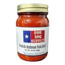 DDR BBQ Supply Portobello Mushroom Pasta Sauce comes in a glass jar with a gold lid, featuring an earthy flavor and a Texas flag graphic on the label. Net Wt. 16 oz (454g).