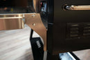 Pimp My Grill® Tactical Stainless Folding Front Shelf attached to the front of a black Recteq RT-800 grill to provide a convenient prep workspace.