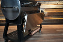 Pimp My Grill Tactical Stainless Folding Front Shelf for the Recteq RT-800 / Deck Boss 800 attached to a pellet grill, providing a convenient workspace.