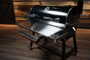 Pimp My Grill Tactical Stainless Folding Front Shelf for the Recteq RT-700 / RT-680, a stainless steel folding grill shelf featuring an integrated tray and a paper towel holder.