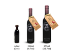 Three elegant bottles of Georgetown Olive Oil Co. Red Apple Balsamic Vinegar—in 60ml, 200ml, and 375ml sizes—each feature a labeled design, with the two larger bottles adorned with apple-themed tags and “Red Apple” text. This rich balsamic vinegar is expertly crafted in Modena, Italy by Georgetown Olive Oil Co., offering a sweet and tangy depth that’s perfect for enhancing your favorite dishes.