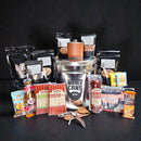 The Manly Cans 3.5 Gallon WeekCAN Warrior Gift Can is packed with jerky, nuts, beef sticks, cheese, mustard, two bottle openers, a flask, peanuts, and a coffee shot—displayed against a black background.