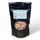 DDR BBQ Supply Manly Cans praline pecans in a black resealable snack pouch with a clear window