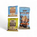 Three Pocket Latte snacks—two Coffee Chocolate packets (cream-blue and yellow) and one Coffee Nuts Mocha + Sea Salt bar with almonds—on a white background. Great savory treats for any Manly Cans 3.5 Gallon WeekCAN Warrior Gift Can.