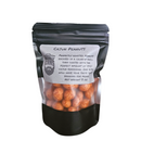 A black resealable pouch labeled Manly Cans Nut Gift Can by Manly Cans shows orange-coated peanuts inside. This spicy, crunchy snack is seasoned with Cajun spices. Net weight: 3 oz.