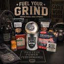 DDR BBQ Supply Manly Cans protein gift can with beef jerky, beef sticks, nuts, and protein bar on a gym floor.