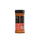 A Rufus Teague Fish Rub bottle with a black lid and pink label is shown upright, displaying the barcode, nutrition facts, and product info—ideal for gluten-free fish recipes—against a white background.