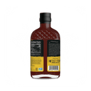 A bottle of Rufus Teague Honey Sweet BBQ Sauce by Rufus Teague with a black cap, shown from the back. The label includes nutrition facts, a story, and bold yellow and black directions urging to EAT ON MEAT!.