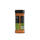 A Rufus Teague Meat Rub jar by Rufus Teague, with a black lid and reddish all-purpose BBQ rub inside, stands upright. Its green-backed label shows nutrition facts, gluten-free certification, and product details.
