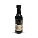A bottle of Rufus Teague Smoke In a Bottle Liquid Smoke with a black cap and beige label, set against a plain white background, adds bold hickory BBQ flavor perfect for enhancing grilled dishes.