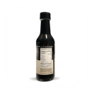 Rufus Teague Smoke In a Bottle Liquid Smoke comes in a dark glass bottle with a black cap and nutrition facts label on the back. Ideal for hickory BBQ flavor, the Rufus Teague bottle is shown against a plain white background.