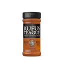 A bottle of Rufus Teague Spicy Meat Rub by Rufus Teague with an orange and black label and black cap stands upright against a white background, promising bold barbecue flavor.