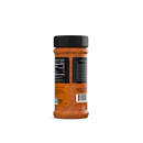 A Rufus Teague Spicy Meat Rub container with bold barbecue flavor and orange BBQ seasoning, shown from the back. The black label shows nutrition facts. The bottle has a black lid and is set against a plain white background. Brand: Rufus Teague.