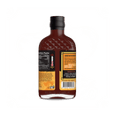 A bottle of Rufus Teague Tres Chiles Pica Dulce BBQ Sauce with a black cap features nutritional info, a sweetness meter, a yellow welcome message, and barcode—ideal for pairing with Latino-inspired pepper flavors.