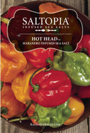 A bowl filled with red, orange, and green habanero peppers displays a SALTOPIA Infused Sea Salts label for Saltopia Habañero Salt: HOT HEAD. Pure sea salt is blended with bold hot pepper flavor. Saltopiasalts.com appears at the bottom.