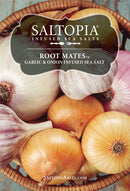 A basket of yellow and purple onions includes a label for SALTOPIA Infused Sea Salts Garlic & Onion Salt: ROOT MATES. The SALTOPIA logo and website are also shown.