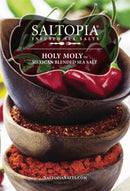 Three stacked wooden bowls filled with red chili peppers and vibrant seasonings, labeled Saltopia Taco Seasoning: HOLY MOLY by SALTOPIA Infused Sea Salts—perfect for adding authentic Mexican flavor to any dish. SalTopiaSalts.com at the bottom.