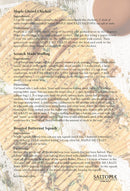 A recipe card titled Maple Glazed Chicken and Scratch Made Stuffing features SALTOPIA Infused Sea Salts' MAPLE ME CRAZY (Maple Garlic & Thyme) as a suggested seasoning, on a stylish parchment background with the SALTOPIA logo and website at the bottom.
