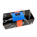 Black rectangular gift box with white kitchen utensil illustrations, blue "Foodie Aficionado Gift Set" label, orange accent, and SALTOPIA Infused Sea Salts branding. Includes Hickory Smoke flavor. Exclusively for Foodie Fans.