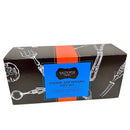 A black rectangular SALTOPIA Infused Sea Salts box with a red stripe and blue label, labeled "Saltopia Gift Set Exclusively for Foodie Fans: FOODIE AFICIONADO," features white kitchen utensil art and flavors like Everything Bagel and Hickory Smoke.