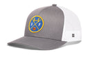 The Haka Hat San Francisco Basketball Trucker Hat | SF X Snapback by Haka Hat features a gray and white design with a round patch displaying a stylized bridge, the letters S and F, and a basketball. The back of this San Francisco basketball trucker hat is crafted from white mesh.