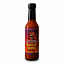 A bottle of Scott’s Smoked Q Bangin’ Berry Strawberry Habanero BBQ Sauce, featuring a label with a cartoon habanero pepper playing an electric guitar and text reading Bangin Berry Hot Sauce.