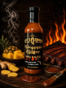 A bottle of Scott’s Smoked Q Pineapple Ginger Sauce Tropical Glaze, Marinade & Dip rests among fresh pineapple, ginger, ribs, and a bowl of sauce, with wood smoke and flames in the background—bringing bold tropical BBQ flavor from Scott’s Smoked Q to your table in every sweet and tangy bite.