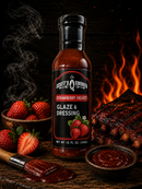 A bottle of Scott’s Smoked Q Strawberry Velvet Strawberry Glaze & Dressing stands among fresh strawberries, a bowl of sweet tangy sauce, a brush, and ribs, with flames and smoke in the background.
