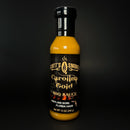 A 12 oz (340g) bottle of Scott’s Smoked Q Carolina Gold Mustard BBQ Sauce for Pork, Chicken, and Burgers by Scott’s Smoked Q, featuring a black label with gold text and standing upright against a black background. Enjoy the tangy Southern flavor of this mustard-based barbecue classic.