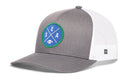 Introducing the Haka Hat Seattle Football Trucker Hat | Royal Blue SEA X Snapback by Haka Hat. This hat features a solid gray front panel paired with a breathable white mesh back in the signature Haka 5.0 trucker style. Accented by a round blue and green patch with “SEA” and a football graphic, it showcases the iconic SEA X colorway in royal blue, green, and white.