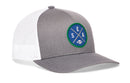 Featuring a mesh back in gray and white, the Haka Hat Seattle Football Trucker Hat | Royal Blue SEA X Snapback by Haka Hat showcases a round blue patch with green trim on the front, crossed lines with the letters S, E, A, and a small football at the center—making it an ideal choice for fans looking for the ultimate Seattle Football Trucker Hat.