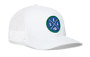 The Haka Hat Seattle Football Trucker Hat | Royal Blue SEA X Snapback by Haka Hat is a white mesh baseball cap featuring a round SEA X green and blue logo patch with crossed bats and a small baseball at the bottom. Shown angled to the left, this Haka signature 5.0 trucker is the perfect way for fans to show their city pride.