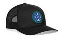 The Haka Hat Seattle Football Trucker Hat | Royal Blue SEA X Snapback by Haka Hat is a black mesh-back trucker featuring the Haka signature 5.0 design, with a round blue and green patch on the front that displays crossed lines, the letters S, E, A, and a small football—highlighting that iconic SEA X green and blue style.