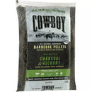 A clear plastic bag of Cowboy 20 Lb. Charcoal & Hickory Barbeque Pellets featuring a cowboy on horseback on the label.