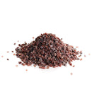 A small pile of The Spice Lab India Kala Namak Mineral Salt Coarse crystals is displayed on a white background, perfect for adding a distinctive flavor to vegan cooking.