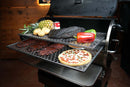 Two stacked Pimp My Grill® Gen2 Slide-Out Rack System - 2 Racks inside a Recteq Flagship 1250 pellet grill holding a pizza, ribs, a large piece of smoked meat, bell peppers, potatoes, and a pineapple.