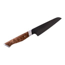 A chef’s knife from the Steelport Knife Co. Full Kitchen Set, featuring a dark, high carbon steel blade and a wooden handle with a swirling grain pattern, is displayed on a white background. This piece showcases the expert craftsmanship of Steelport Knife Co., an American-made kitchen knife set.