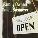 A sign that says Welcome, we are open, please come in hangs on a door. Text above reads Family Owned Small Business. The softly blurred background sets the perfect scene to discover Hickman's BBQ Party Fowl Chicken Rub Pack of 2 inside—signature poultry seasoning and BBQ chicken rubs from Hickman's BBQ.