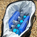 Duck camo soft-sided cooler from Bison, filled with ice packs and bottled water.
